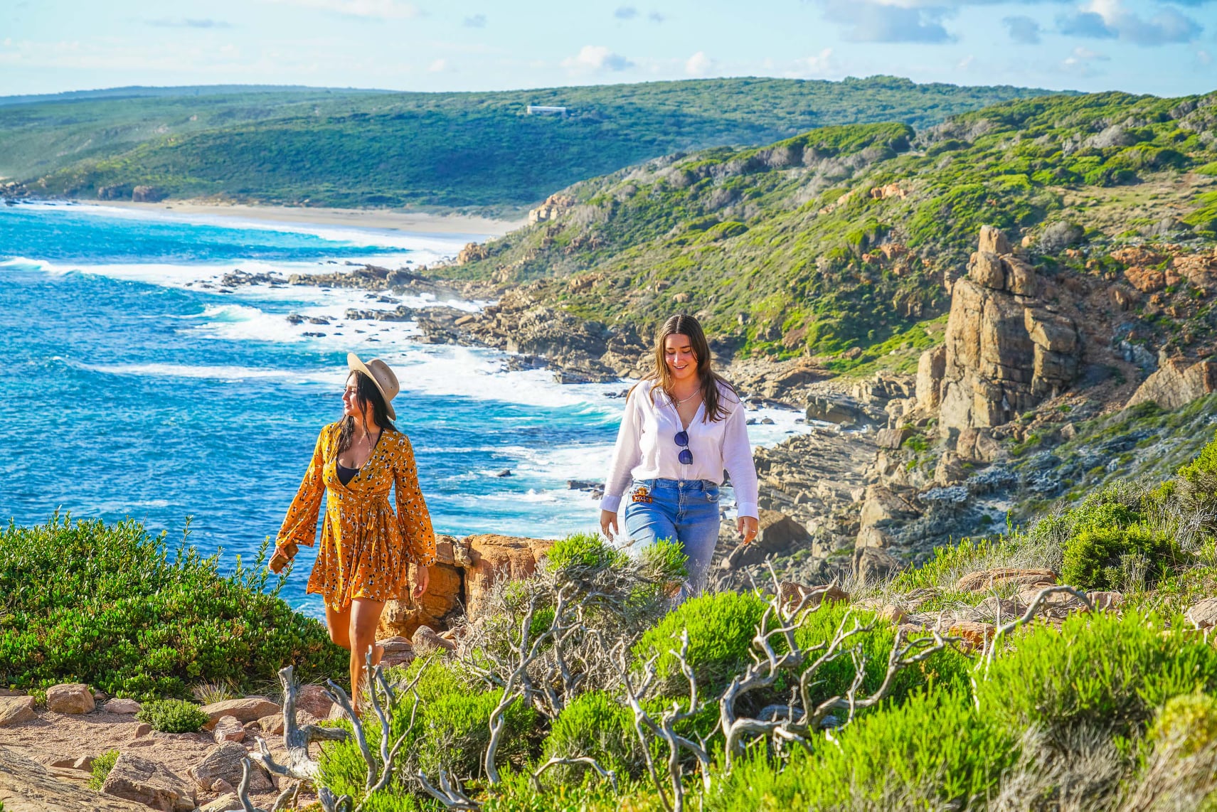 Two girls walking along the Cape to Cape Track