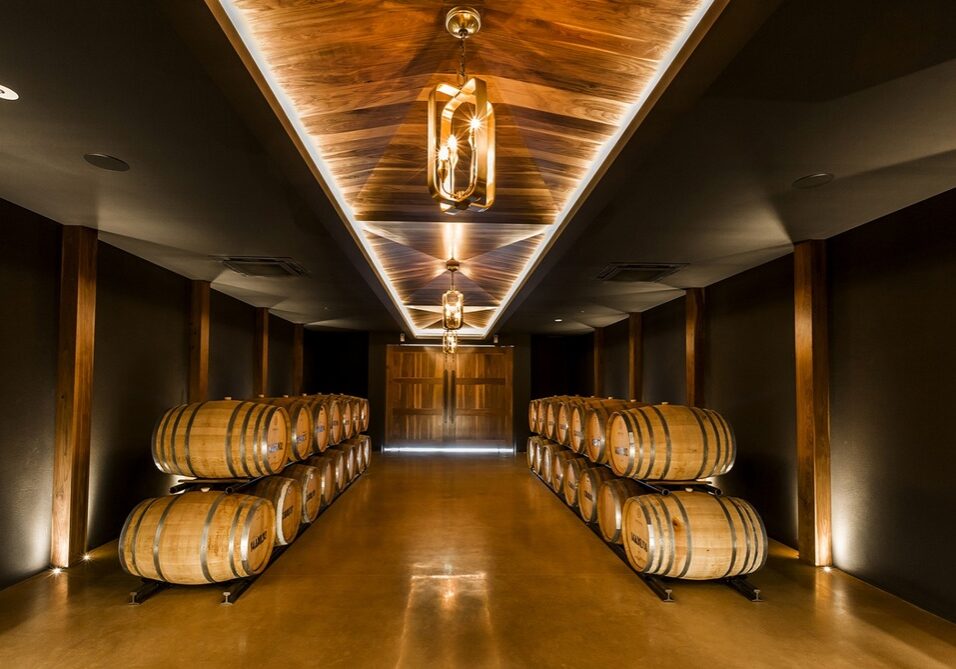 Barrel room filled with wine barrels as you enter Amelia Park Wines