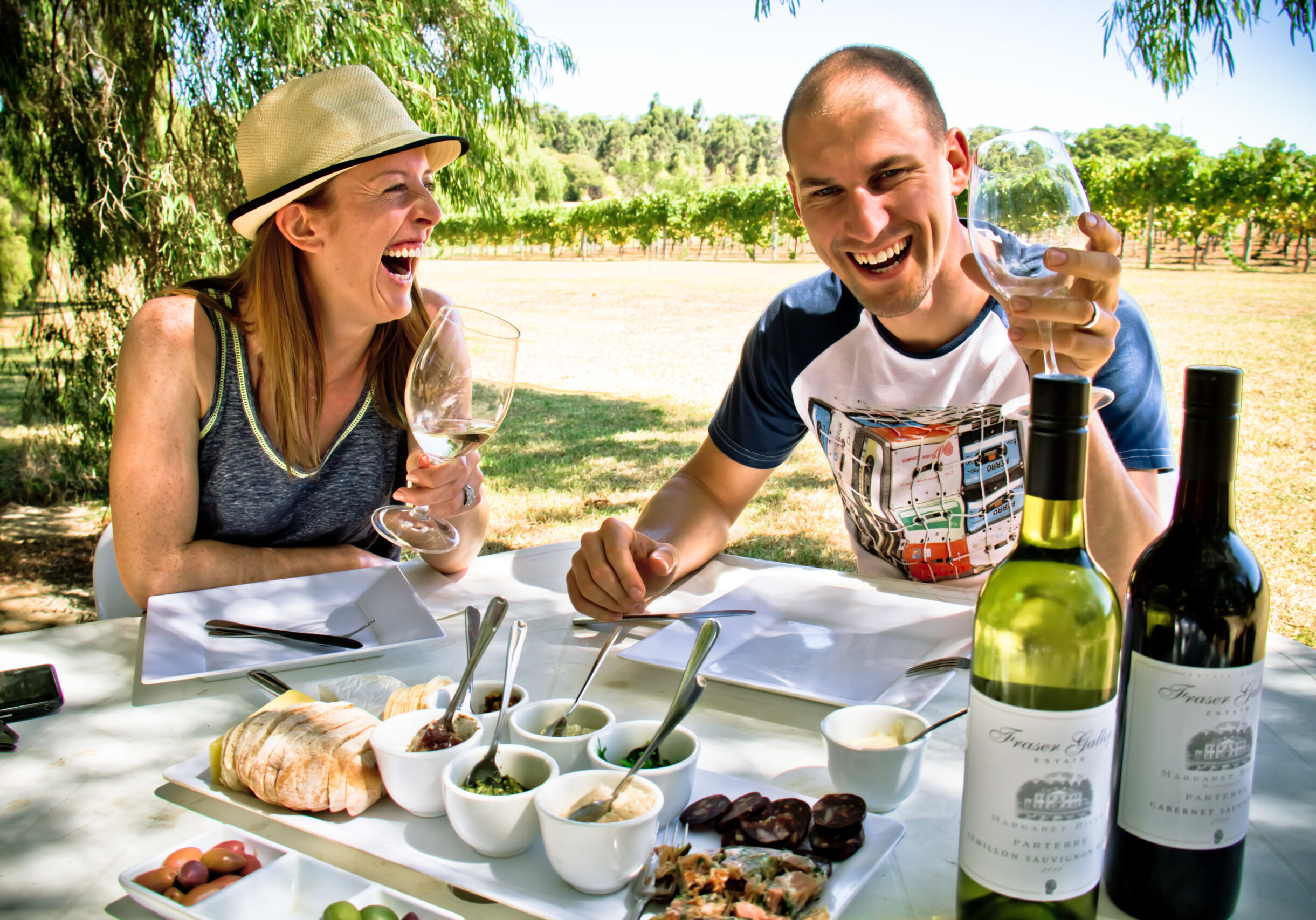 Very happy, laughing guests having lunch whilst on the Margaret River Discovery Tour