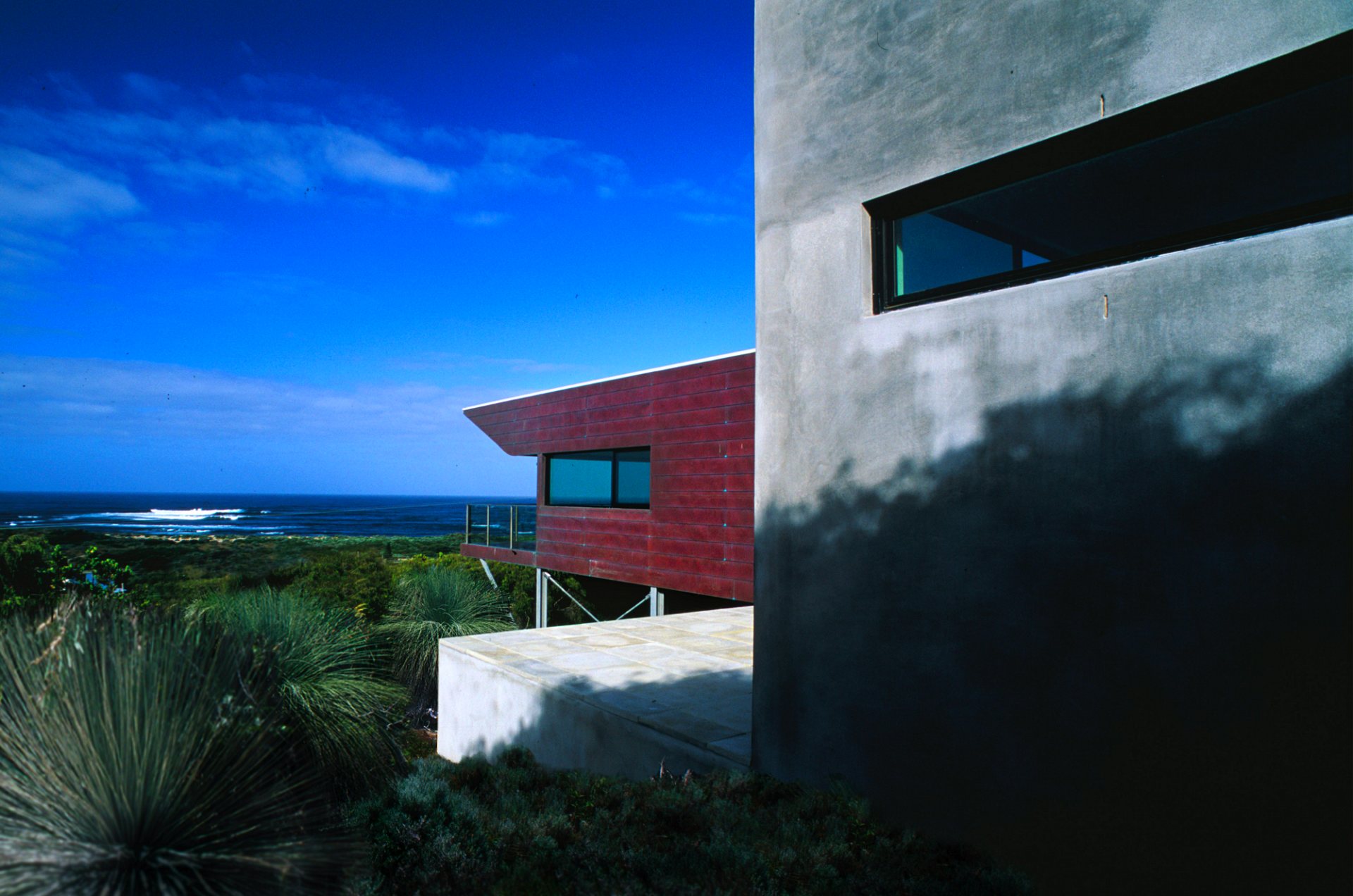 Southern elevation of architectural award winning beach house built with copper and concrete overlooking the Indian Ocean.